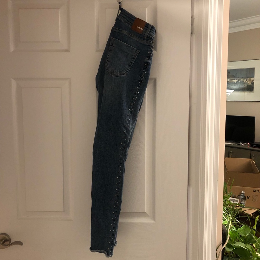 Zara mid rise blue denim with metal studs along the sides